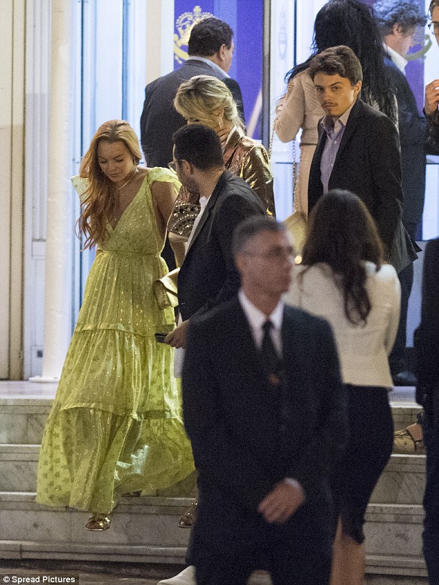Pulling out the stops: Lindsay was dressed to impress for the friendly dinner and went all out for the occasion in a show-stopping lime green gown